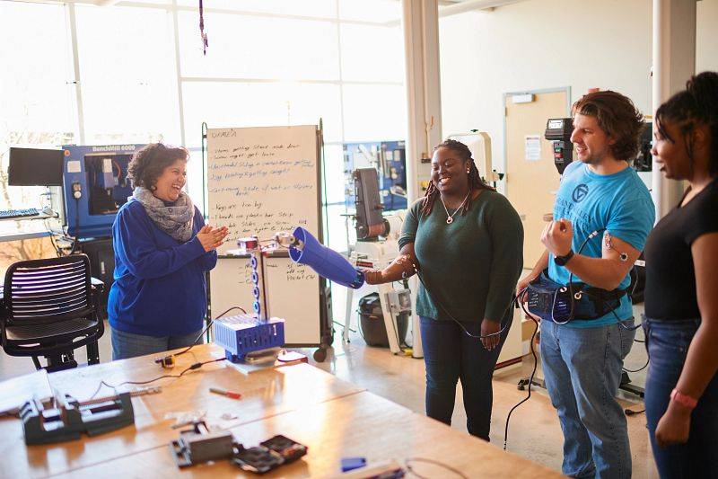 GVSU professor working with Engineering students.